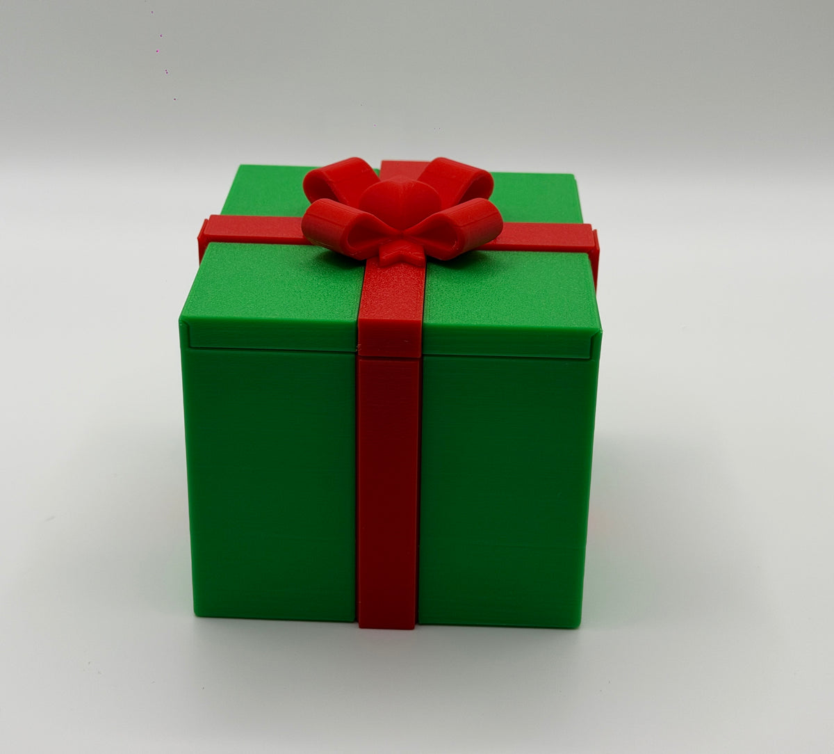Pointy finger gift box – red box, white bow